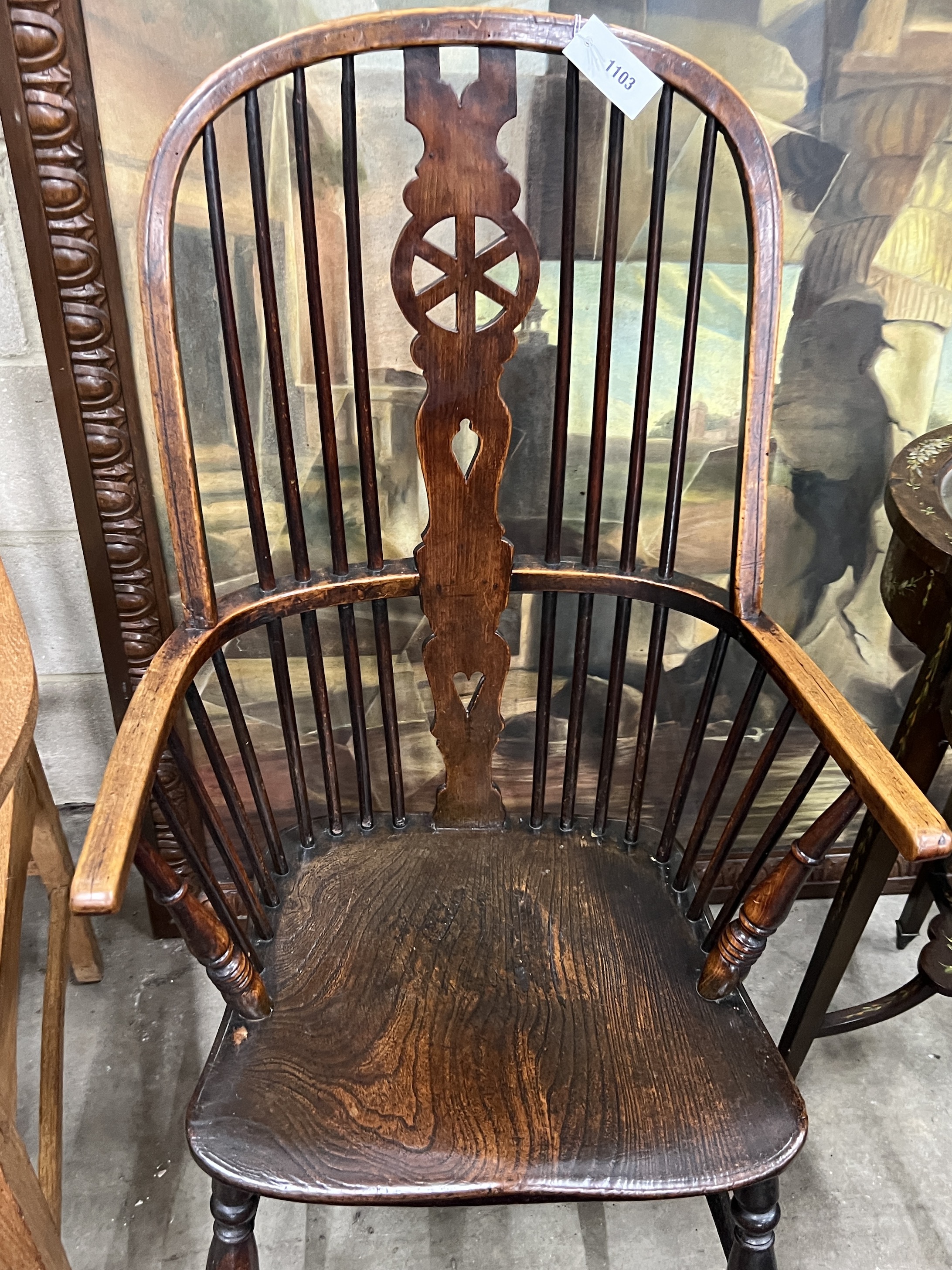 A mid 19th century Windsor elm and beech comb back armchair with pierced central splat, width 58cm, depth 42cm, height 111cm